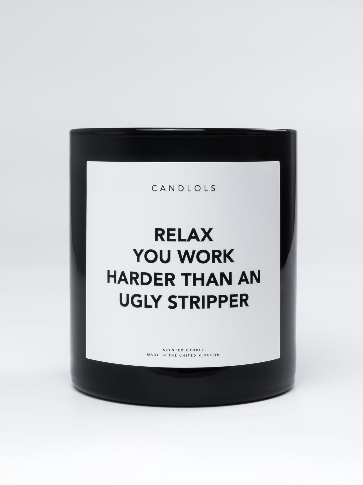 'Relax you work harder than un ugly stripper' candle