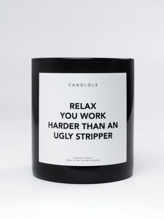 'Relax you work harder than un ugly stripper' candle