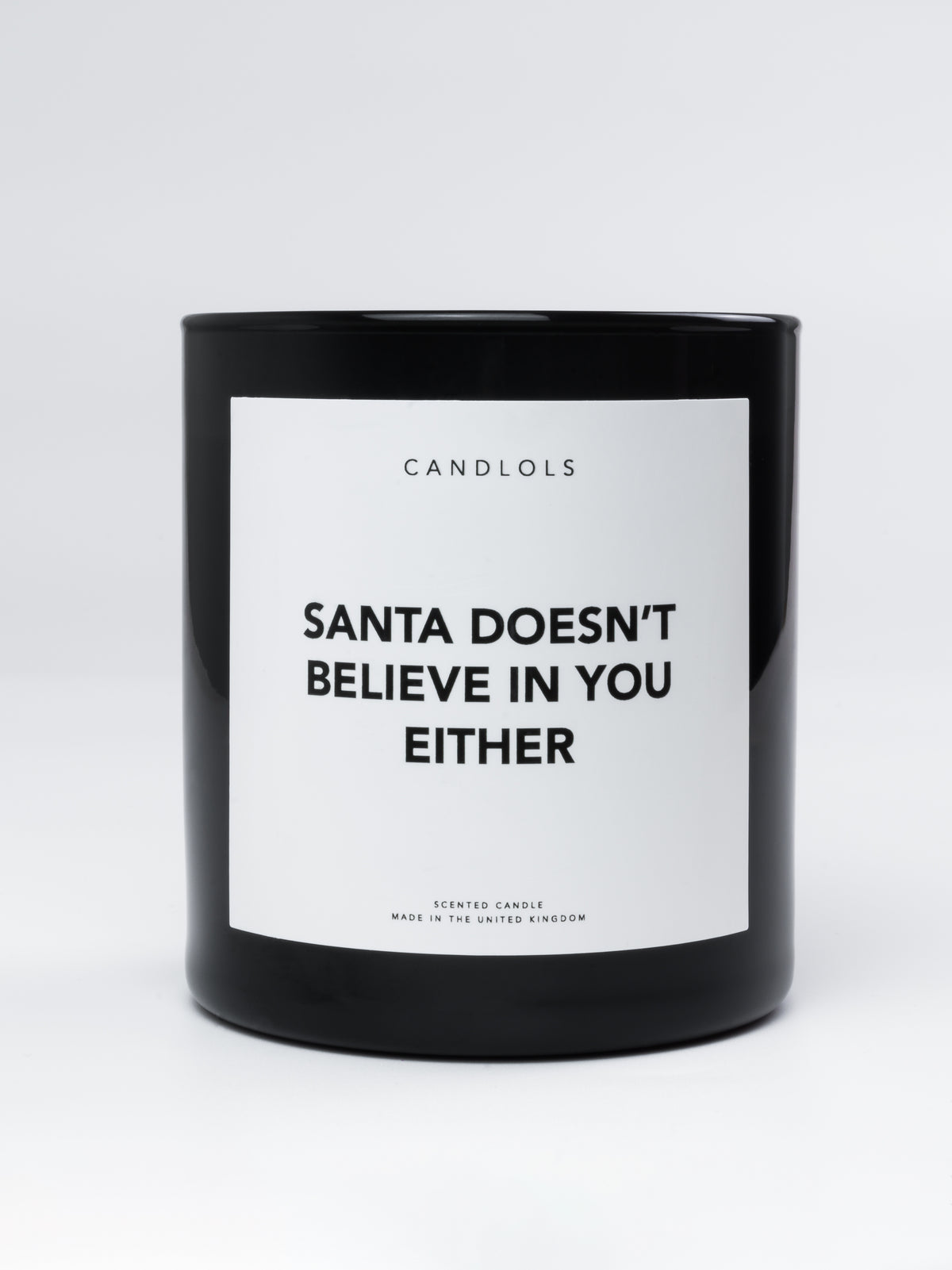 'Santa doesn't believe in you either' Candle