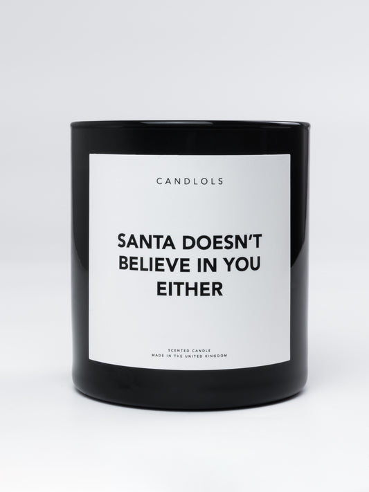 'Santa doesn't believe in you either' Candle